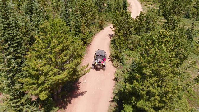 Drone follows SXS on the trail.