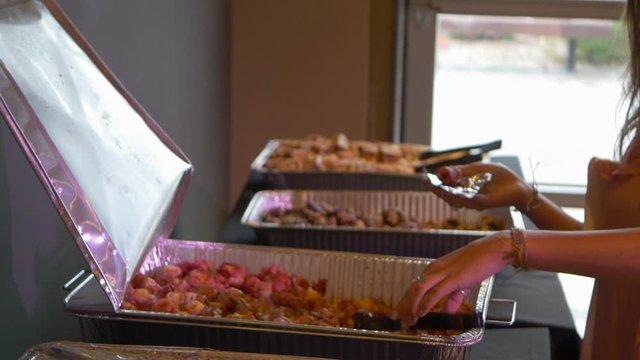 Women Getting Food from Buffett.