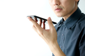 Men use smartphones to chat with voice commands.