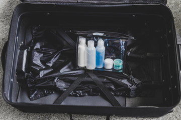 packing for a flight, transparent bag with small lotions for liquids and gel for security check...