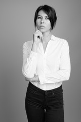 Portrait of young beautiful businesswoman shot in black and white