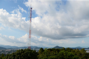 Communications Tower with a Blue Sky Background. Radio tower with antennas on a blue sky background.