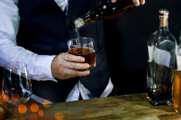 Bartender Serve Whiskey, on wood bar 