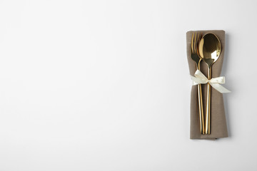 Cutlery set for festive table on white background, top view