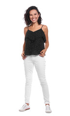 Happy young woman in casual outfit on white background