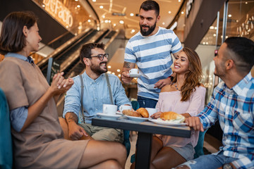 Friends having a coffee together
