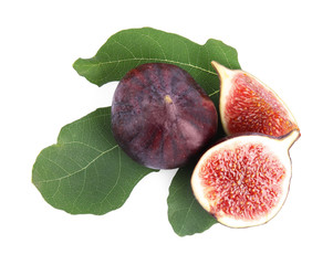 Fresh juicy purple figs and green leaves on white background, top view