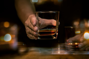 Bartender Serve Whiskey, on wood bar 