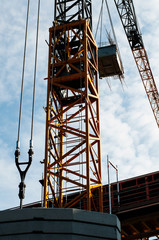 counterweight of large cement blocks at construction crane