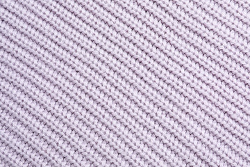 Light winter sweater as background, closeup view
