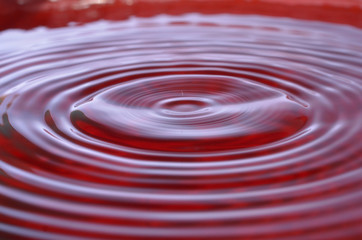 Abstract water drop splash background red