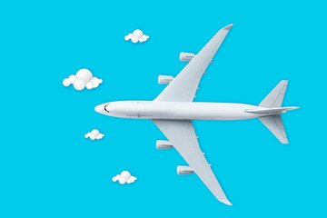 Fototapeta premium airplane flying in the sky with clouds