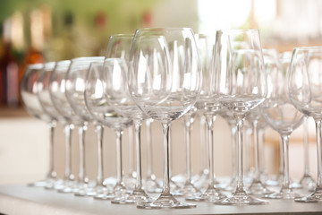 Empty glasses on table against blurred background