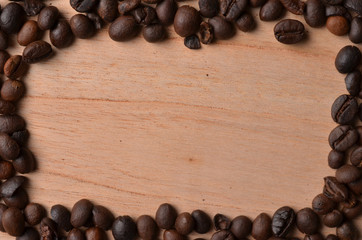Background coffee beans on wood with empty space for text