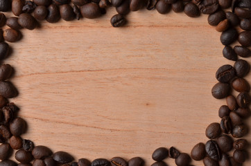 Background coffee beans on wood with empty space for text