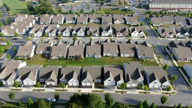 Aerial drone shot of identical cookie-cutter homes in suburban community in Lancaster County, Pennsylvania, USA, growth and suburban sprawl theme