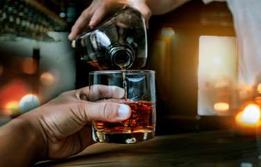 Bartender Serve Whiskey, on wood bar