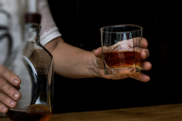 Bartender Serve Whiskey, on wood bar, 