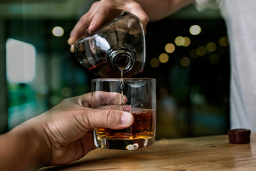 Bartender Serve Whiskey, on wood bar,