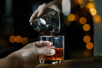 Bartender Serve Whiskey, on wood bar 