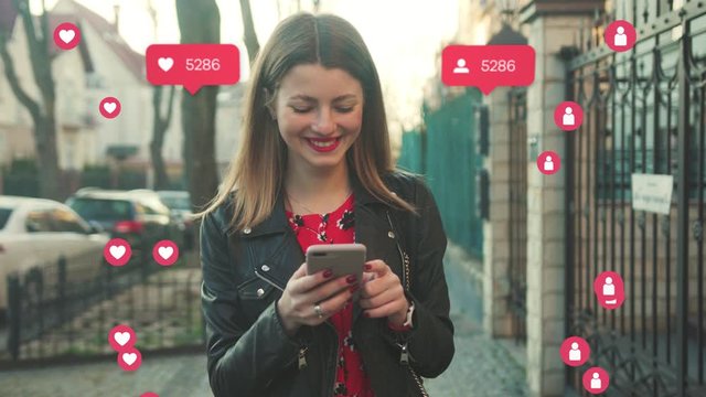 Portrait of Charming Girl in Stylish Look Checking News on Smartphone. Vlogger Influencer. Animation with User Interface - Likes, Followers, Comments for Social Media from Smartphone. Response