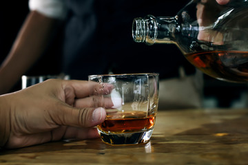Bartender Serve Whiskey, on wood bar,