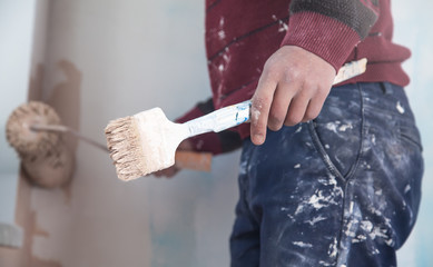 Professional painter with roller. Renovation