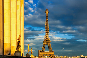 Fototapeta na wymiar The Eiffel Tower warmed by golden light at dawn