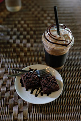 Iced coffee and chocolate cake.