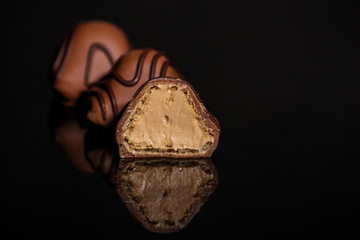 chocolate candy (delicious dessert, sweets with filling, cut sweets) menu concept. food background. copy space. Top view