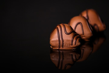 chocolate candy (delicious dessert, sweets with filling, cut sweets) menu concept. food background. copy space. Top view