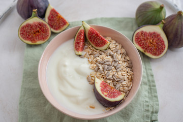 Fototapeta na wymiar healthy yogurt with fresh figs on a table