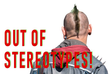 The man with mohawk hairstyle, is photographed behind, in earring ears, on a shoulder thorns.