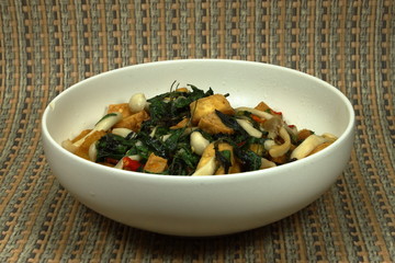 Fried mushroom, tofu and basil with spicy sauce, chilly and pepper. Hot and delicious menu in Asia. Vegetarian menu, healthy and diet menu.