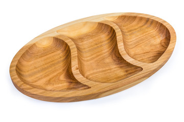 Wooden compartmental dish with three departments on a white background