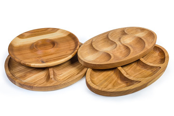 Different wooden compartment dishes and serving boards on white background