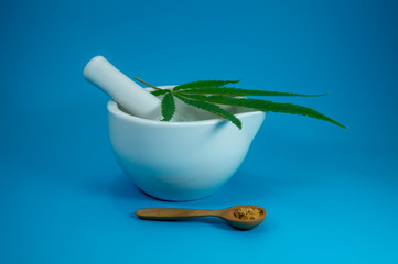 Cannabis leaf on grinding bowl