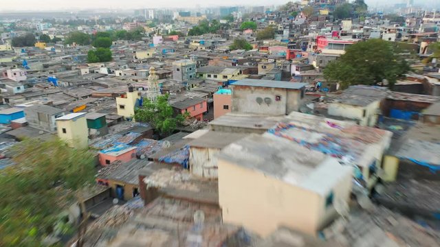 Aerial: Houses in slum against sky - Mumbai, India