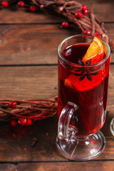 Christmas mulled wine on a wooden table. Traditional hot drink at Christmas (red wine with spices, New Year's Eve, Noel holiday festive) x-mas flat lay. food background. copy space. Top viev