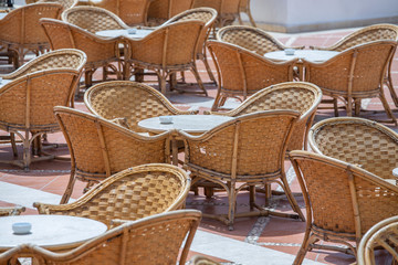 Rattan table and chairs in beach cafe next to the red sea in Sharm el Sheikh, Egypt