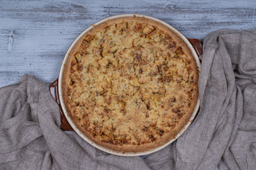Homemade organic apple pie dessert ready to eat, close up. Apple tart with walnut. Close up