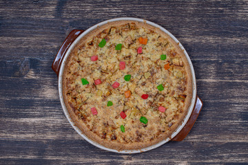 Homemade organic apple pie dessert ready to eat, close up. Apple tart with walnut. Close up