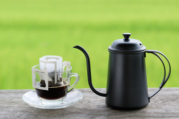 Jar and cup of espresso,Coffee home  made style,Green color background