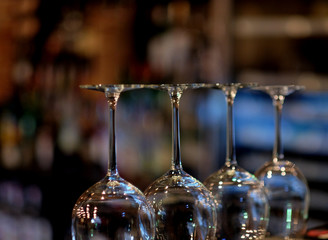 inverted glasses in a bar, close up
