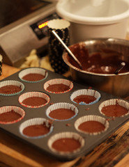 the process of preparing cupcakes - before sending to bake, close up