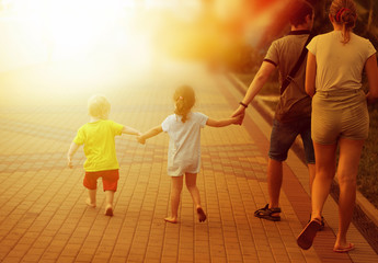 Naklejka premium Photo of happy family on a walk in the park
