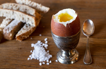silver egg cup and egg