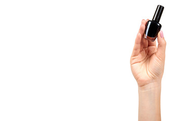 Hand with black nail polish bottle, beauty and care.