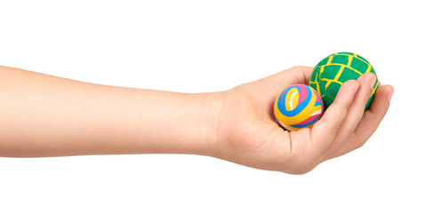 Fototapeta premium Children hand with color rubber ball, kids educational toy.