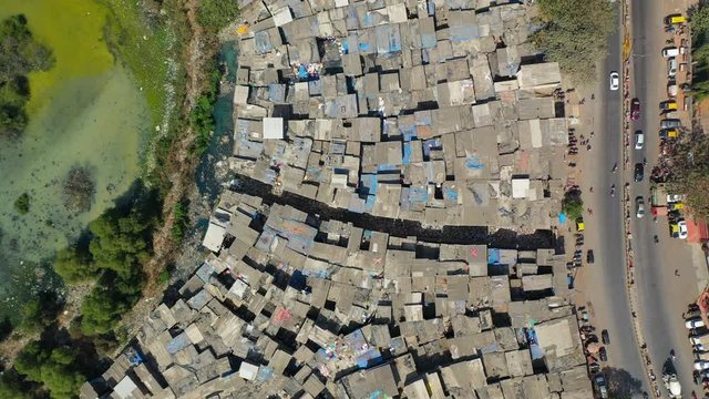 Aerial: Houses amidst swamp and road in city - Mumbai, India